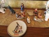 Collection of Hummels...vintage Christmas Hummels including Baby Jesus, Angels candleholders, Hear ye Hear ye, and a Gobel Schnauser;