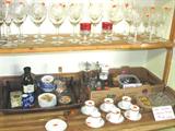 Some of the excellent glasswares that are in this sale...including the colored and clear stemware shown here; Also shown are some of the china cup and saucer sets and hand painted plates that are also available. Other items shown are also available.