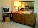 Beautiful Vintage Bedroom Set by American of Martinsville...includes Dresser with golden oak finish and 8 large drawers, 4 small center drawers, and a mirror; two (2) matching two tiered nightstands; Two (2) Single Beds with Single Size Sealy Contessa IV Bed Sets...mattresses, boxsprings, and frames. (Nightstands and Single bed sets are pictured elsewhere in this collection) Accent Table Lamp pictured is also available. Also pictured is an oak TV Stand / Computing cabinet with bookshelf storage; Color TV also pictured is available too.