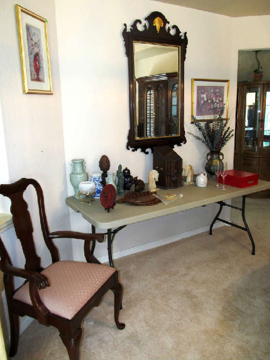 Elegant Mahogany Federal Style Wall Mirror with ornately carved pediments; also shown is one of the Penna. House mahogany Dining Arm Chairs which are matcing to the other  dining chairs...dining table, china cabinet and server which are pictured elsewhere in this collection;Other items pictured (other than the folding table) are also available.