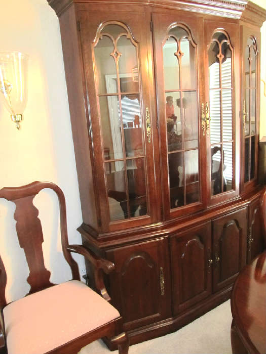 Excellent Penna. House Lighted China Cabinet with 4 glass and wood doors with brass pulls in top section and lots of storage / display on shelves and in lower section door and drawer storage.  China Cabinet is part of matching Dining Room Set  by Pennsylvania House...includes Queen Anne Style  Dining Table with mahogany finish, 2 extra leaves, and with table pads, 6 matching Queen Anne Style Dining Chairs with padded feet (2 Arm Chairs and 4 Side Chairs); Matching Pennsylvania House lighted China Cabinet with 4 glass & wood doors with brass pulls in the upper section, and lots of storage / display/ storage in drawers and door storage; Matching Pennsylvania House Server with Double door and drawers storage;