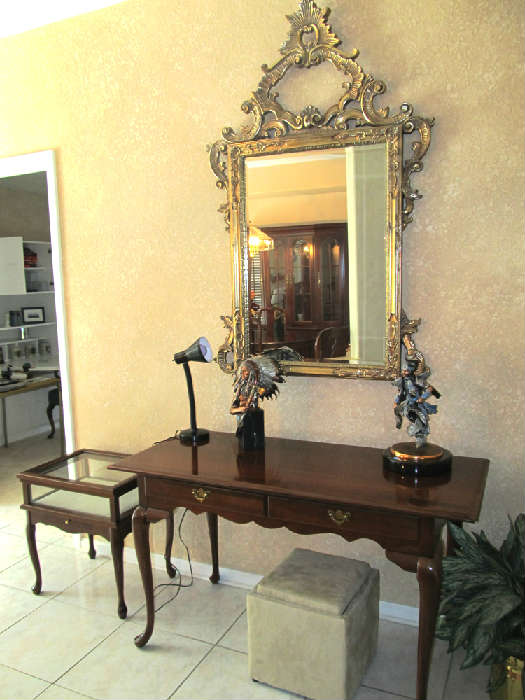 Excellent accent tables...from Left to Right: Left is a unique mahogany Queen Anne Style Shadow Box End Table made with glass & wood box display / storage; Center is an elegant mahogany Broyhill Queen Anne Style Foyer Table with drawers storage and brass pulls;  Also pictured are a few of the extensive collection of  "Legends" C.A. Pardell's Limited Edition metal / Composite art sculptures which are very collectible.   As pictured are (from left to right) Leftmost sculpture  is C. A Pardell's limited edition sculpture "Eminent Crow" ...it is a sculpture of Chief Plenty Coups and is  retired no longer in production sculpture that originally sold for $1,500. (limited edition 792 of 950 ); Right is C.A. Pardell's limited edition sculpture "Dancing Ground"... (limited edition 7 of 750 and had an original selling price of $2,650.00). Both are in excellent condition.  Also pictured is a large ornate gold gilt framed wall mirror;
