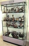 Legends Display Cabinet...A wonderful way to display your collection of Legends C.A. Pardell sculptures.  This cabinet is lighted and has locks to secure the contents.  It is of metal and glass construction with glass shelving for display / storage.  The sculptures shown in the cabinet are only a portion of the approx. 60 C.A. Pardell metal / composite scupltures that are available in this sale.  Many are retired no longer in production limited edition sculptures.  Most of the major pieces are pictured separately in this collection.
