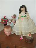Some of the doll collection available in this sale...some are vintage including the as shown vintage Madam Alexander "Gone with the Wind" doll, and vintage doll heads...including the small antique girl doll head with eyes that close and wig, and the vintage German Bisque boy doll head (more dolls shown elsewhere in this collection)