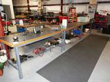 Some of the many metal work tables with storage that are available in this sale; storage cabinets and open shelf storage units are also available; floor Matting and the extension ladder are also available. Other items pictured are also available.