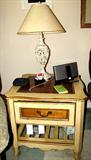 One of Two Vintage Continental Style End Tables with drawer storage and brass pulls, and book shelf storage. Top has attractive honey colored wood inlays. (other end table is pictured separately elsewhere in this collection). End Tables are matching to a coffee table which is also pictured elsewhere in this collection. Accent Table Lamp is available