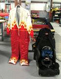Racing Suit worn by Phil Simms...it was called his "Elvis suit"...excellent condition...beautiful flame colored accents; Also shown is an auto racing Race Car Seat and helmet used by Phil Simms at auto racing events.
