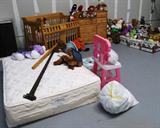 Convertible Crib mfg. by Crib 4 Life... it converts from a crib to a youth day bed to a full size bed...as your child grows up... but it will continue to be a stylish piece of furniture over the years. Also shown is a matching Baby Changing Tower Table with lots of drawer storage...pine with light finish... Also shown is a Barbie Play Set and lots...and lots of stuffed animals and toys.