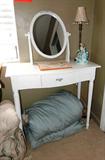 Continental Style Vanity with oval movable mirror and center drawer storage with brass pull, and white Shabby Chic finish. Small accent table lamp and the porcelain figurine shown are also available