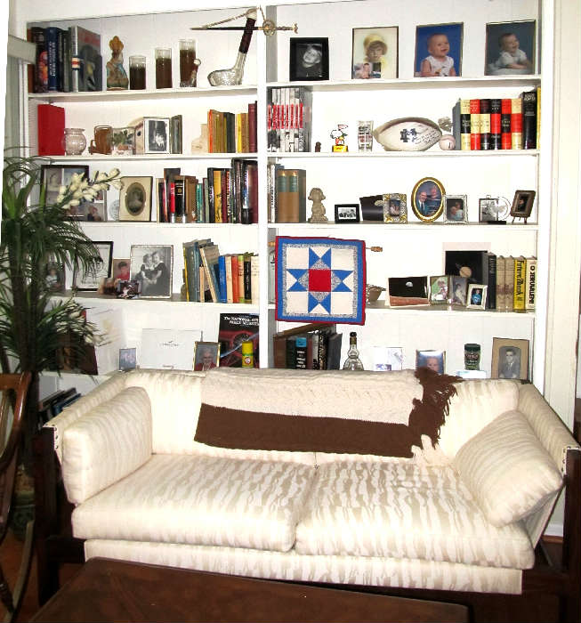 Mid Century Style Sling Style Sofa with wood & metal frame and sling strapping characteristic for this style sofa, and  Off  White colored Upholstery (Likely circa 1960's).  Other Items shown are also available...books (aviation, religious, others), navigational sailing items, etc.