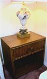 Vintage Drexel Oriental Style Night Stand with Drawer storage, brass pulls and rich pecan color finish; Accent Table Lamp pictured is also available. Night Stand is part of Vintage Drexel Bedroom Set...Includes Drexel Queen Size Headboard with Oriental Style basketweave accents along the top border, and a rich pecan color finish; Queen Size Simmons Beauty Rest Premier  Mattress & Boxsprings ,frame; Matching Vintage Drexel Oriental Style Triple Dresser with Mirror...with Basket weave accents along borders, and with 9 drawers storage and  brass pulls. Rich Pecan Color Finish (Other items of this set are pictured elsewhere in this collection); Also shown is a Vintage Italian Design Accent Table Lamp...very ornate base...with delicate floral accents