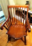 Antique Spindle Back Rocking Chair with Curved Arms and shield shaped seat...with beautiful walnut wash finish...nice patina