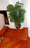 Vintage Colonial Style two tiered Coffee Table with spindled legs and maple finish; Also shown is one of several accent silk plants which is also available along with the brass pot it is in
