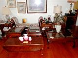 Vintage Drexel  Drop Leaf Coffee Table with fold down leaves, decorative legs with Spanish style feet, and beautiful rich mahogany finish; Also shown is a Oriental Style Coffee Table with Inlaid Beveled Glass top and nicely curved legs. Also shown are  two  matching Oriental Style end tables with inlaid beveled glass top.  Coffee and End Tables are also matching to an Oriental Style foyer / sofa table with inlaid beveled glass top which is pictured separately in this collection.  Also shown is an  Vintage set of Nesting Tables...two matching tables in set... each with nicely scalloped accented tops and nicely turned legs...and  rich looking mahogany finish;  Also shown is a Continental style end table with nicely carved Cabriolet style legs,  drawer storage and brass pulls...rich looking mahogany finish; Also shown is a Vintage Continental Style Sofa Lounge / Settee with nicely carved features and colorful floral upholstery...excellent accent piece (I know by now you must be a bit cros