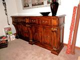 Home Collection Mediterranean Style Side Board / Buffet with rich finish and doored and drawers storage; Sideboard / Buffet is matching to Dining Room Table which is pictured elsewhere in this collection.