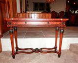 Beautiful Foyer / Sofa Table with rich burl wood finish, beaded wood trim, medallion accents, reeded legs with nicely carved leaf accents.
