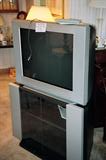 Sony Trinitron Color TV, 28". Also, TV Stand with shelf storage