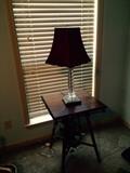 antique oak table and one of a pair of acrylic lamps