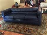 beautiful CLASSIC LEATHER navy leather sofa, on a beautiful rug!