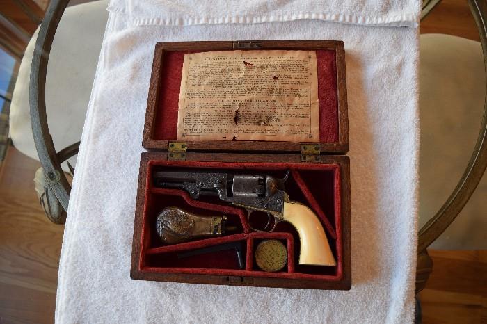 1849 Pocket 31 Cal. Mfg 1860. Cased with Accessories. Gustave Young Factory Engraved with Ivory Grips. 4 Inch Barrel, Shooter Excellent Condition
