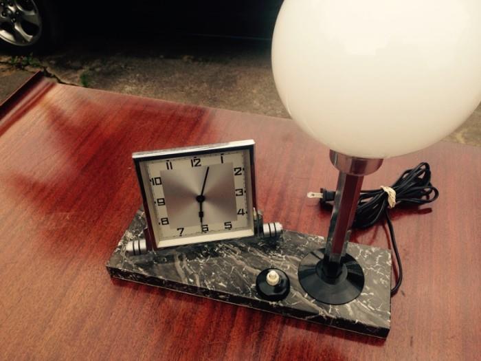 Art Deco clock with lamp on a marble base-working condition.