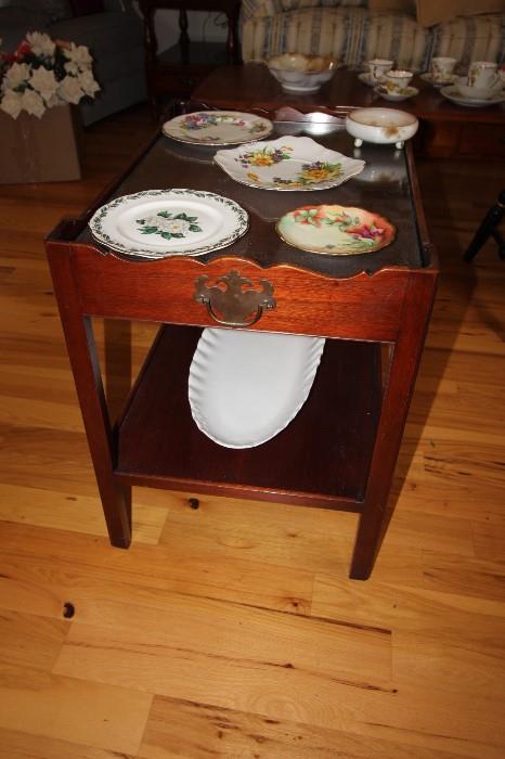 Tea tray end table, Limoges plate and other bone china.