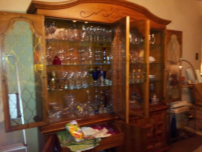 China cabinet with linens and glassware/barware
