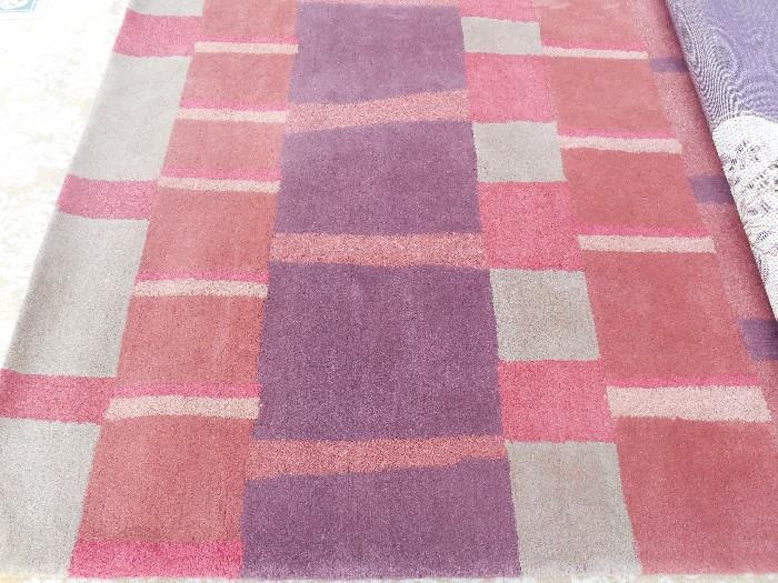 rust and purple wool rug 5 x 8