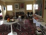 Saarinen style table, Richard Hull signed prints, children's bookcases & books, Pair of Harry Bertoia chairs, rugs, Jonathon Adler pillows, Lance Friedman handmade blue glass vase, Felt balls & wooden fruit fr/ Material possessions, etc. 