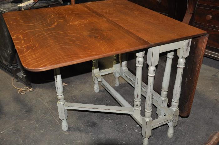 Antique gate legged English pub table with tiger oak top.  Folds down to 16" inches.