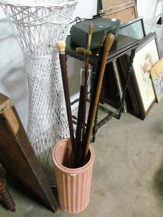 antique and vintage swagger sticks and canes; some with bone and horn handles from england.  and umbrella stand.