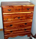 Five drawer cedar chest is part of bedroom suite.