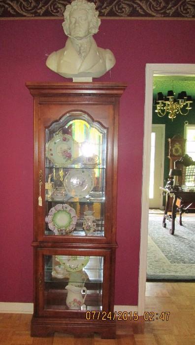 Display cabinet with antique plates, etc