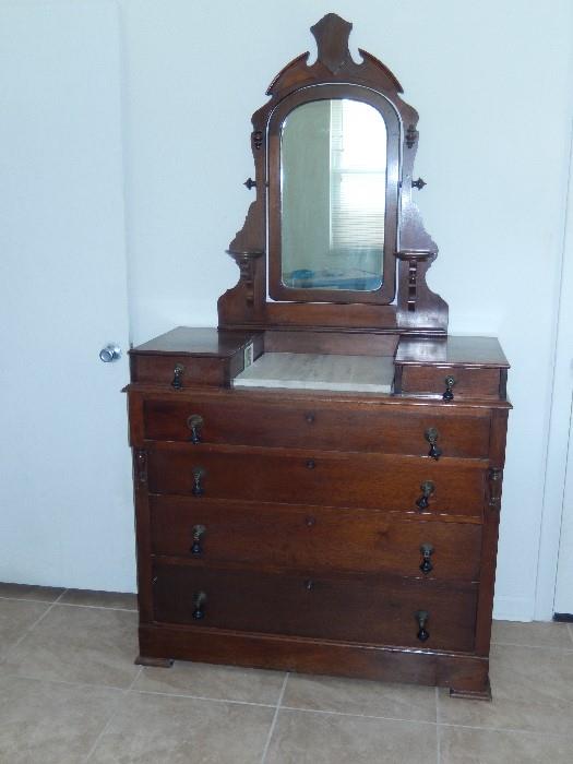 DRESSER COMPLETE WITH GLOVE BOXES AND CANDLE STANDS WALNUT WITH MARBLE INSERT AND DROP PULLS. EVERYTHING IS ORIGINAL. CIRCA 1860'S.