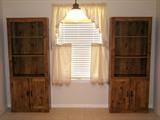 Pre-selling - 2 bookcase cabinets or cupboards. The cabinets have 3 exposed shelves and double door cabinets in the base. Measurements: 29.5” wide x 11.5” deep x 72.25” tall. The cabinets are available for $80 each.