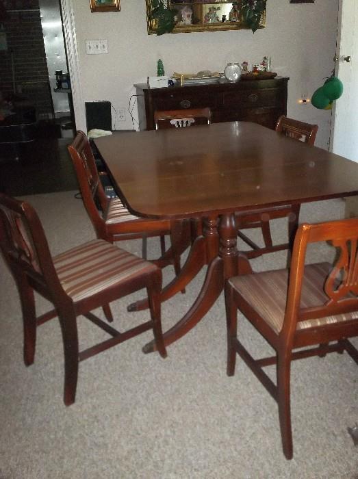 Mahogany drop leaf table 8 chairs and extra leaf 