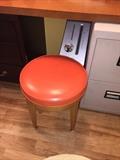 MID-CENTURY MODERN ORANGE ROLLING STOOL
