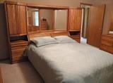 Blackhawk solid oak bedroom suite. This wall unit headboard is amazing.  Mattress and box springs are not for sale.