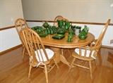 Whitacre's solid oak table with 6 chairs. Extra leaf and 6th chair not shown.