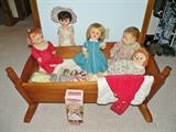 Solid wood cradle and vintage dolls. 