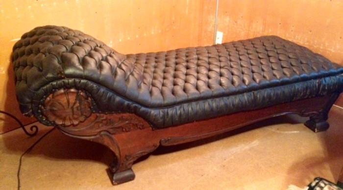 Fabulous Handcarved Fainting couch in Black Leather....in need of reupholstery...but a stunning piece!