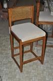 Two wooden cane back stools by Whitaker Furniture Co. available