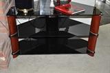Three shelf black glass and cherry wood entertainment stand