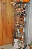 Halloween, Easter and Thanksgiving decor displayed inside a 4 shelf glass cabinet by IKEA