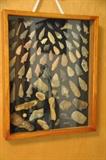 Arrowhead collection framed in shadow box