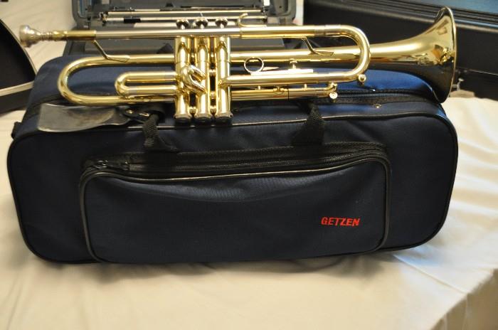 Getzen 300 series gold brass trumpet with case