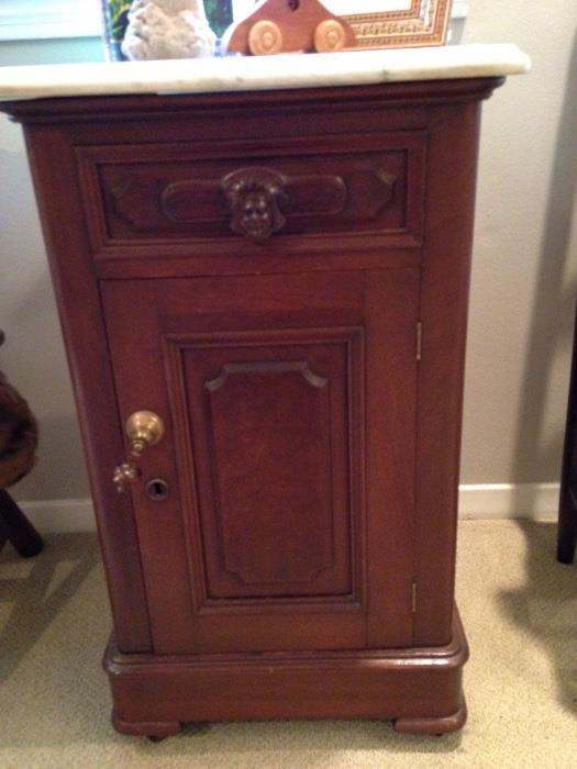 Marble top commode/ night stand on casters with unusual Indian head pull $265