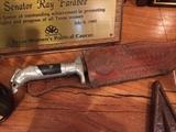 Mexican knife in leather sheath.