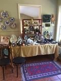 Foreground: pair of metal ice cream parlor chairs, 32" by 54" Kerman rug, various majolica, cookbooks, more