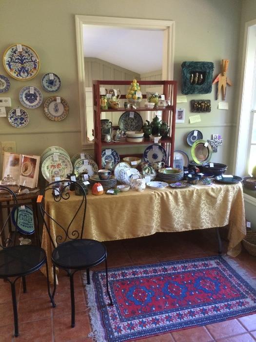 Foreground: pair of metal ice cream parlor chairs,  32" by 54" Kerman rug, various majolica, cookbooks, more